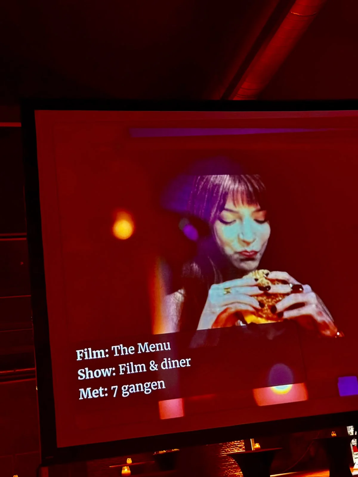 Écran de Cinema Culinair annonçant The Menu, film et dîner en sept services à Gand.
